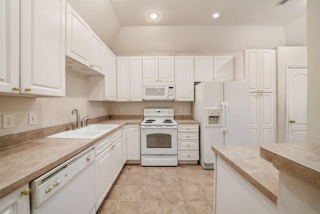 kitchen with lofted ceiling, sink, white cabinets, and white appliances