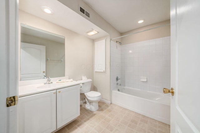 full bathroom featuring toilet, tiled shower / bath combo, and vanity