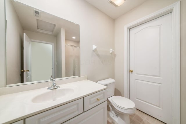 bathroom featuring toilet, tile patterned flooring, and vanity