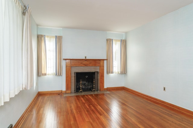 unfurnished living room featuring wood-type flooring