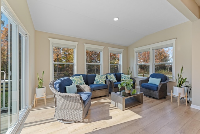 sunroom / solarium with lofted ceiling and plenty of natural light