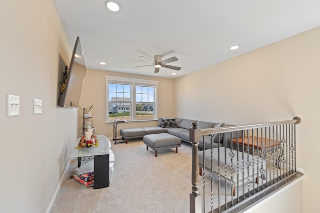 living room with ceiling fan and carpet floors