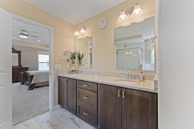 bathroom featuring ceiling fan, walk in shower, and vanity