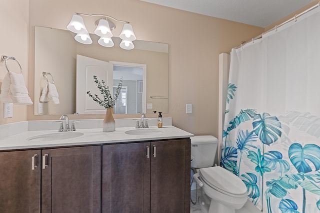 bathroom with toilet and vanity