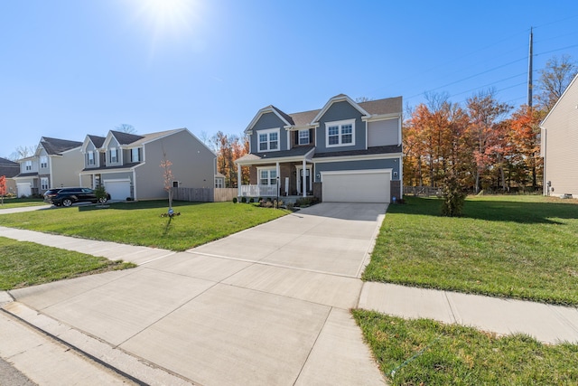 front of property featuring a front yard, a garage, and a porch