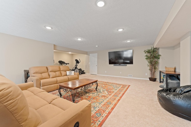 carpeted living room featuring a textured ceiling