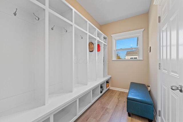 mudroom with light hardwood / wood-style floors