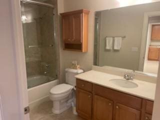 5735 Newbank Cir Unit 208, Dublin, OH 43017 - full bathroom featuring toilet, vanity, and bath / shower combo with glass door