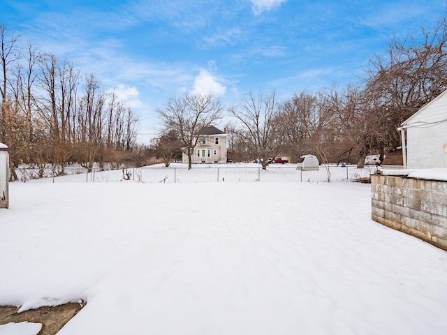 view of yard covered in snow