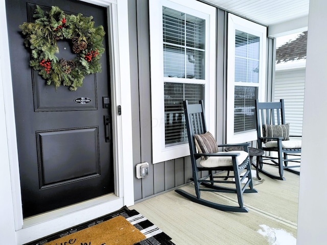 doorway to property featuring covered porch