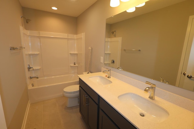 bathroom with toilet, tile patterned floors, a sink, and shower / bathtub combination