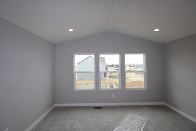 interior space with baseboards, lofted ceiling, and recessed lighting