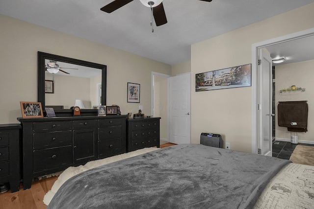 bedroom featuring ceiling fan and light hardwood / wood-style flooring