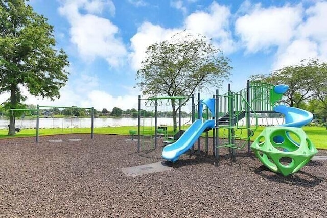 view of playground with a water view