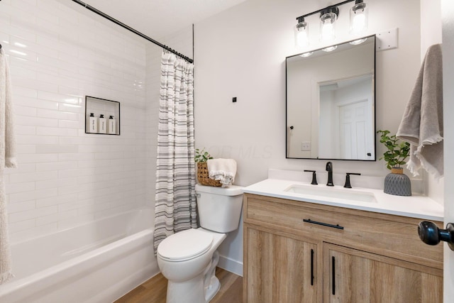 full bathroom featuring hardwood / wood-style floors, toilet, vanity, and shower / bathtub combination with curtain