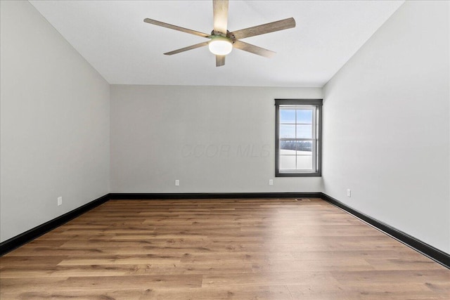 spare room with ceiling fan and light hardwood / wood-style floors