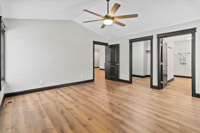 unfurnished bedroom with vaulted ceiling, ceiling fan, and light hardwood / wood-style floors