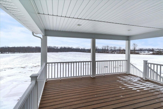 view of snow covered deck