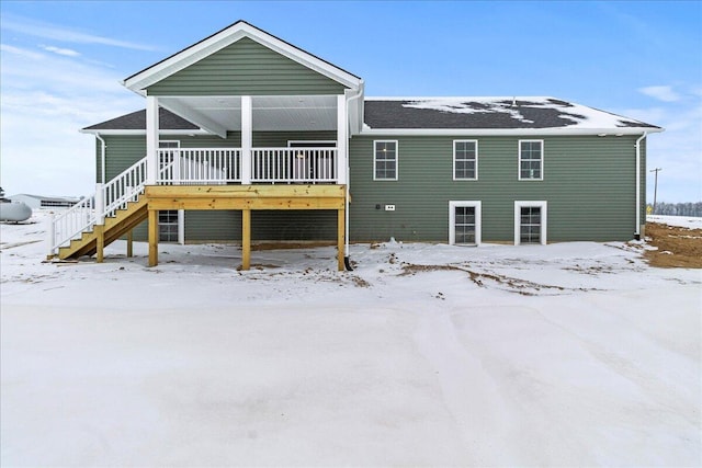 view of snow covered house