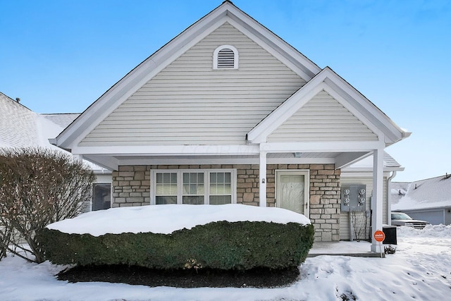 view of front of home featuring stone siding