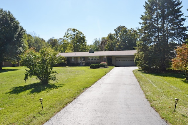 ranch-style house with a front yard and a garage