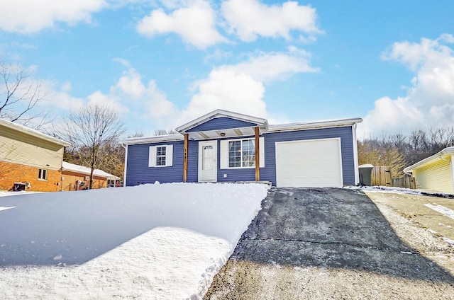 single story home featuring a garage