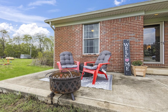 view of patio / terrace featuring an outdoor fire pit