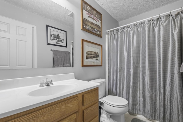 bathroom featuring toilet, vanity, a shower with shower curtain, and a textured ceiling