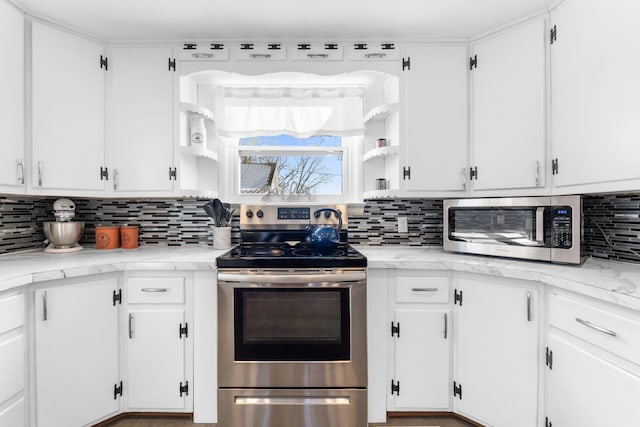 kitchen featuring white cabinets, backsplash, and stainless steel appliances