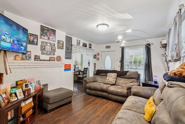 living room featuring dark wood-type flooring