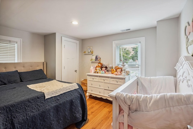 bedroom with light hardwood / wood-style flooring