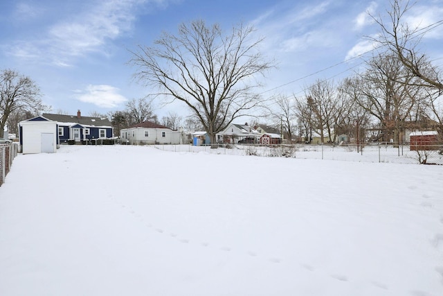 view of yard layered in snow