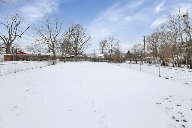 view of yard layered in snow