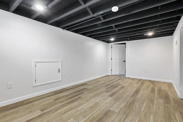 basement featuring light hardwood / wood-style flooring