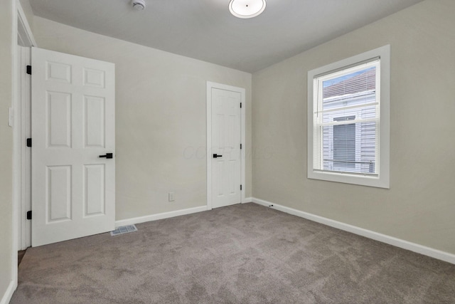 view of carpeted spare room