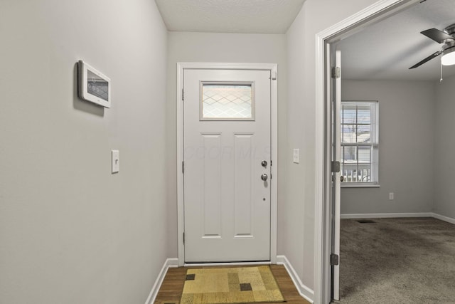 entryway featuring ceiling fan