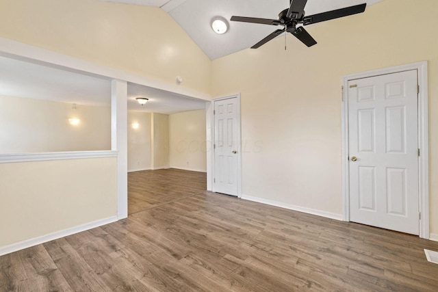 spare room featuring ceiling fan, high vaulted ceiling, and hardwood / wood-style floors