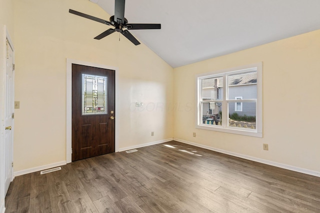 foyer entrance featuring ceiling fan, dark hardwood / wood-style floors, and lofted ceiling