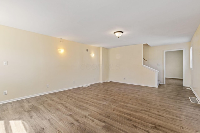 unfurnished room featuring hardwood / wood-style flooring