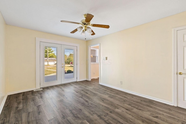 unfurnished room featuring ceiling fan, dark hardwood / wood-style flooring, and french doors