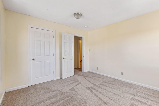 unfurnished bedroom with light carpet