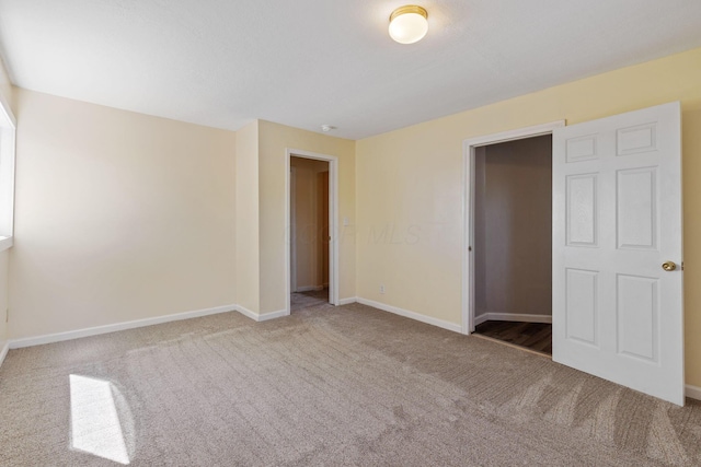 unfurnished bedroom with carpet and a closet