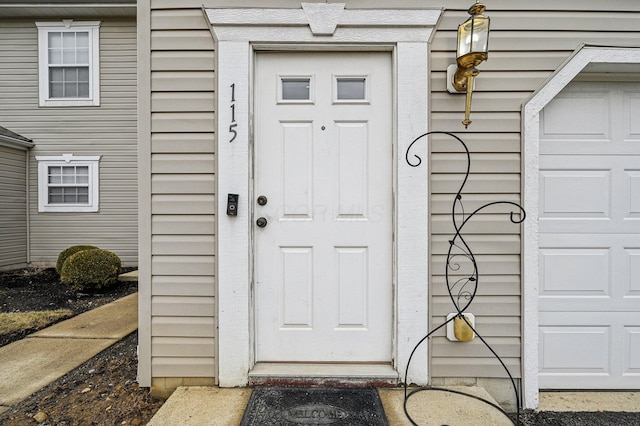 property entrance with a garage