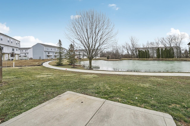 view of yard with a water view and a residential view