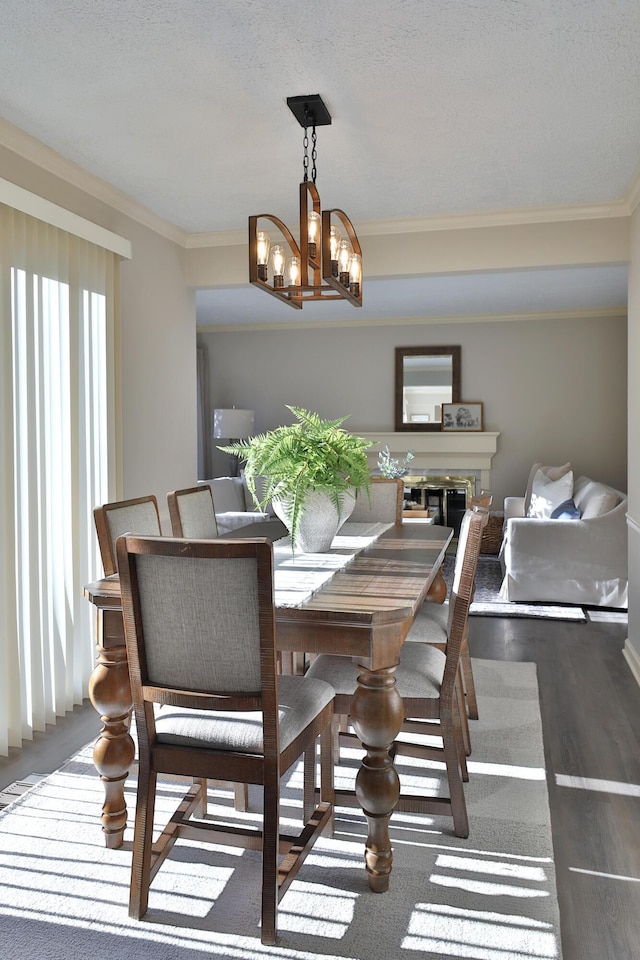 dining room featuring ornamental molding and an inviting chandelier