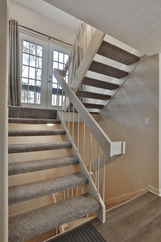 staircase featuring wood-type flooring