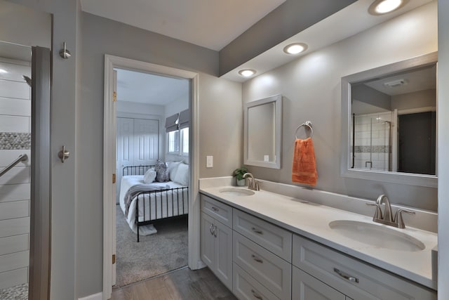 bathroom with vanity and hardwood / wood-style floors