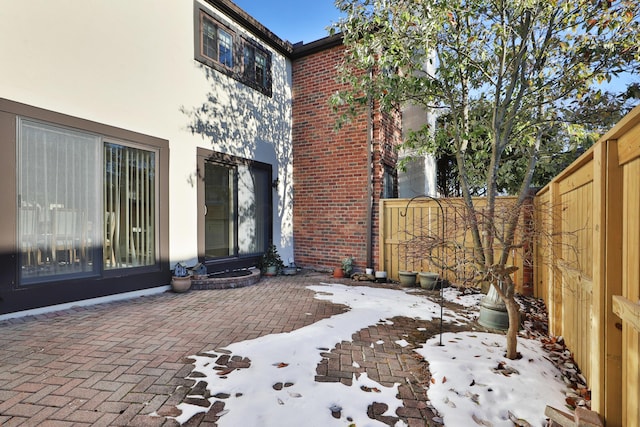 view of snow covered patio