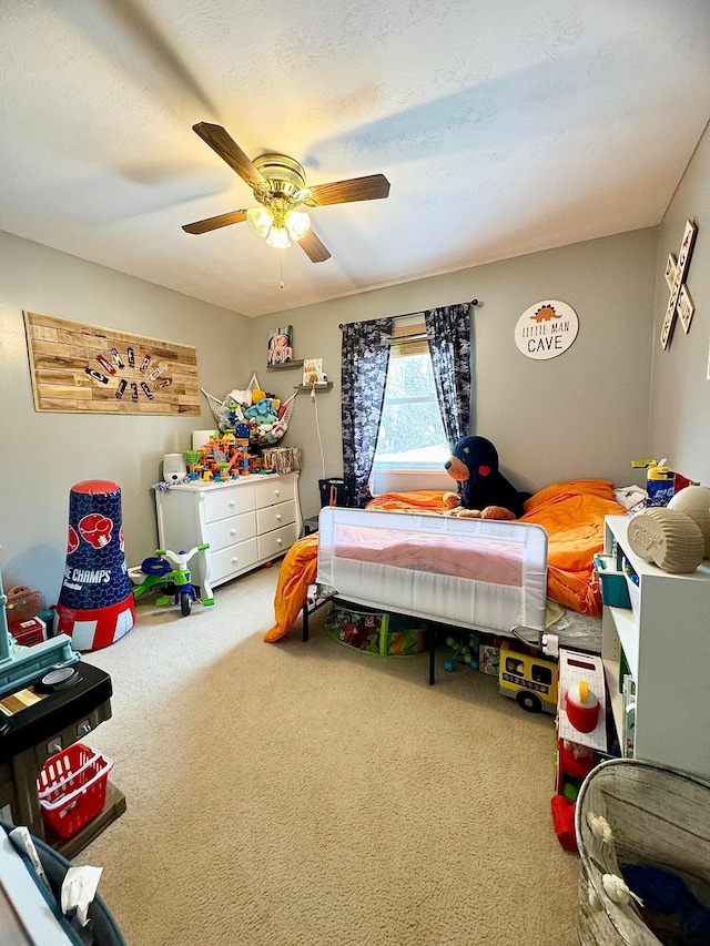 carpeted bedroom with ceiling fan