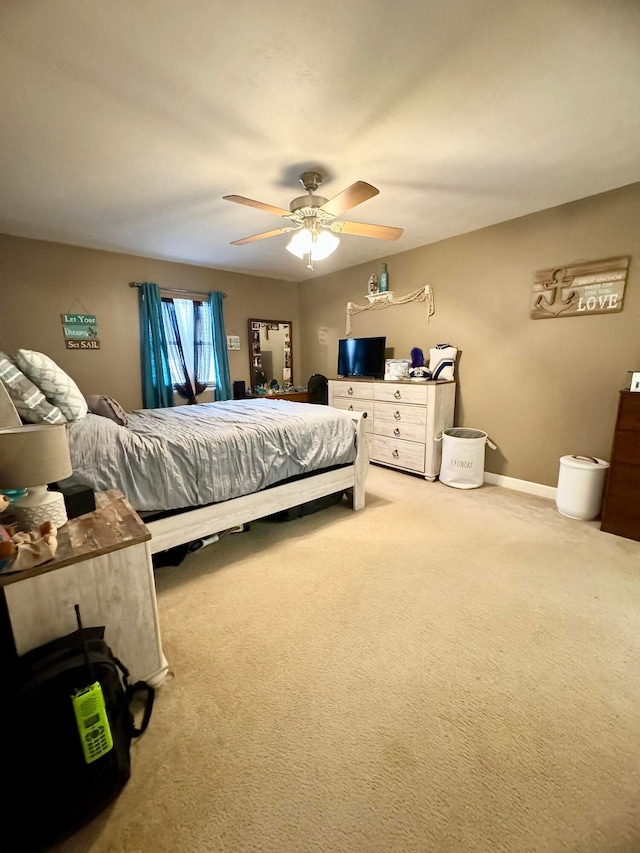 bedroom with ceiling fan and carpet flooring